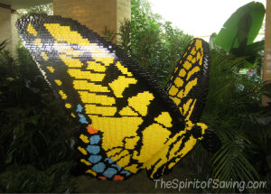 A large yellow and black butterfly made from Lego blocks at Nature Connects Lego Exhibit at Lauritzen Gardens.