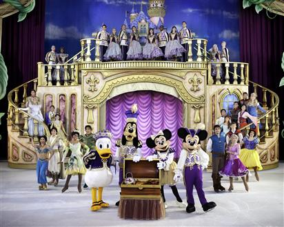 A group of Disney Mickey Mouse characters on a stage with a castle backdrop for Disney on Ice presents Treasure Trove.