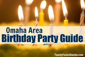 A close up of a  birthday cake with lit candles with overlay text that reads Omaha Area Birthday Party Guide.