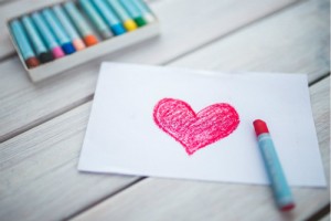 A close up of a heart drawn on a card.