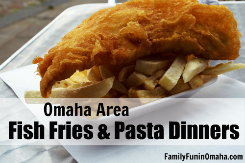 A close up of a fried fish and french fries sitting on top of a paper plate with overlay text that reads Omaha Area Fish Fries and Pasta Dinners