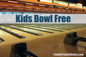 A close up of a bowling alley with overlay text that reads Kids Bowl Free.