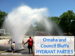 A group of people playing a chute of water with overlay text that reads, \"Omaha and Council bluffs Hydrant Parties.\"