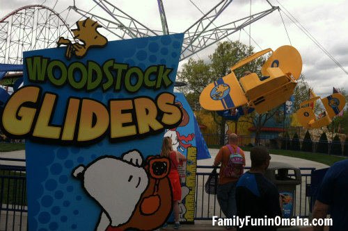 A sign for Woodstock Gliders in front of the ride at Worlds of Fun.