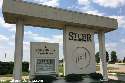 A large white display and entrance sign at Stuhr Museum