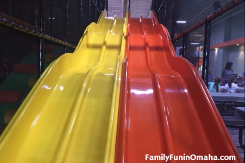 Large indoor racing slides at Urban Air Adventure Park.