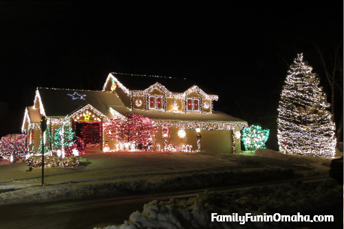 A house decorated with Christmas lights at night