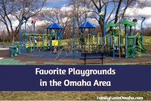 A large blue and yellow children\'s playground with overlay text that reads Favorite Playgrounds in the Omaha Area