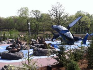 A park with seal and whale sculptures at Alaskan Adventure Splashground.