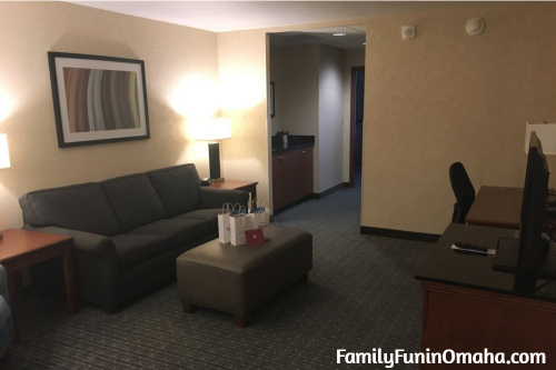 The living area in a hotel room at the Drury Inn and Suites St. Louis Brentwood.