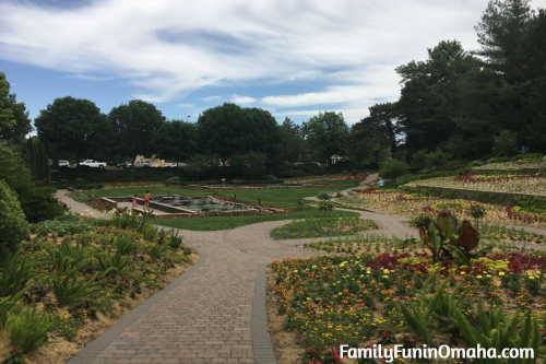 A close up of a garden with stone paver paths