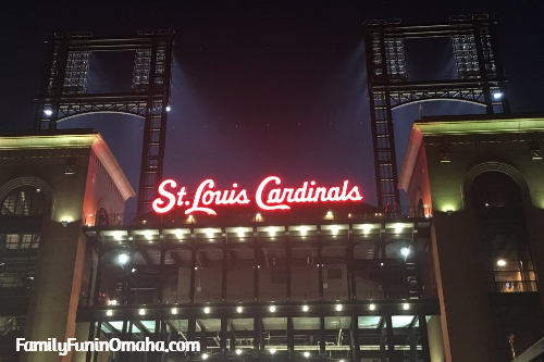 A sign over a ball park tht reads, \"St. Louis Cardnials.\"