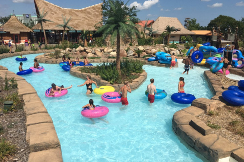 A group of people at the entrance to a lazy river at Lost Island Waterpark.