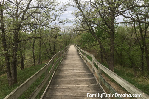 A long wooden walking trail with fencing at Hitchcock Nature Center.